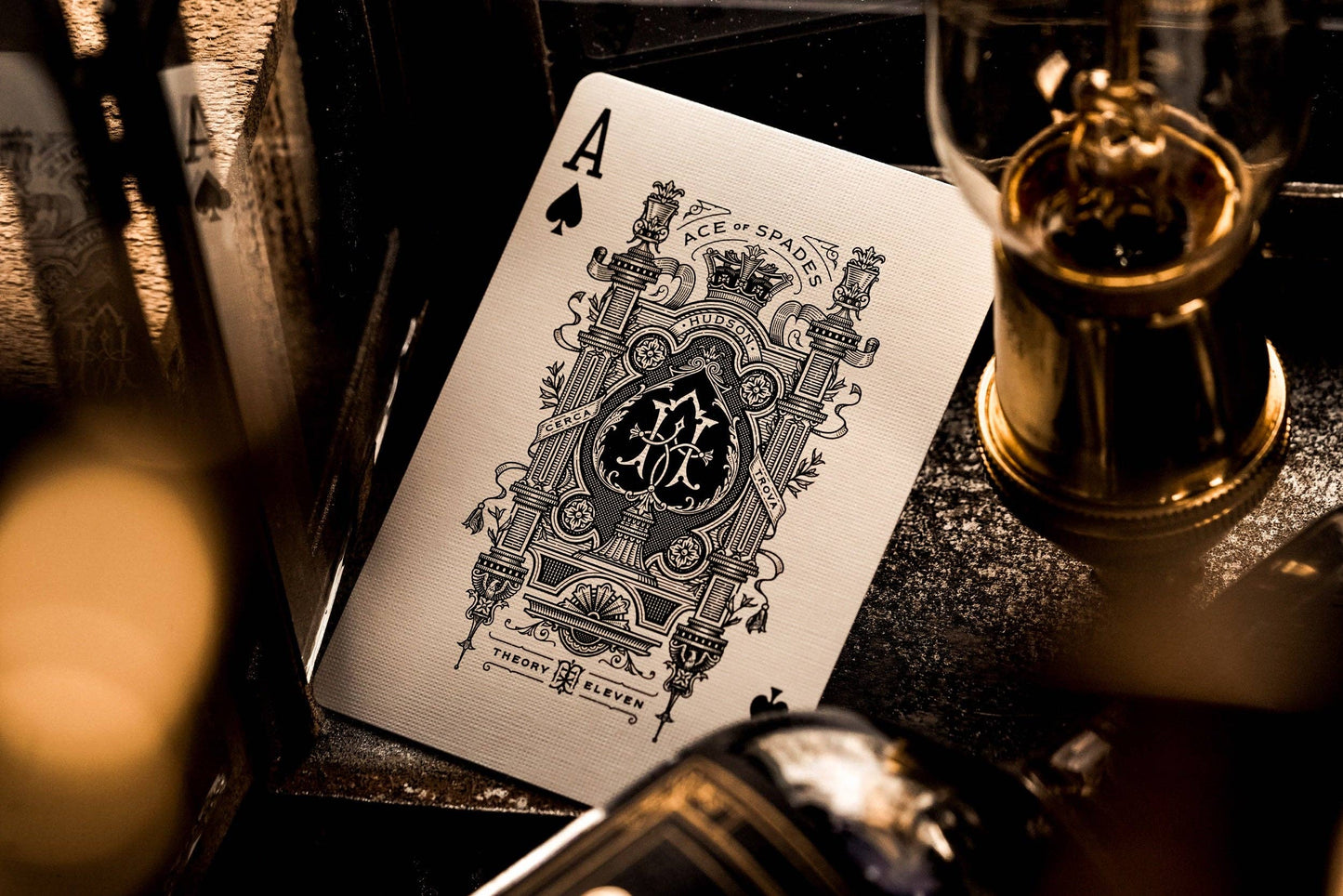 Playing card with a black and white design on a dark surface.